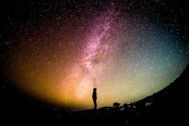 man look up the starry sky greg-rakozy-oMpAz-DN-9I-unsplash