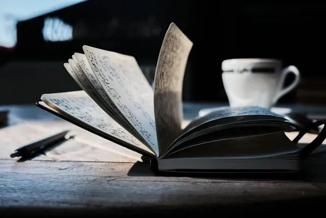 book and coffee yannick-pulver-hopX_jpVtRM-unsplash